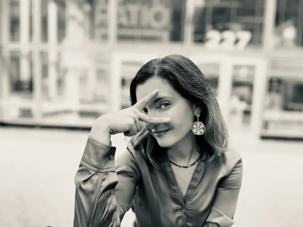 Yoana looking through her fingers in a playful manner